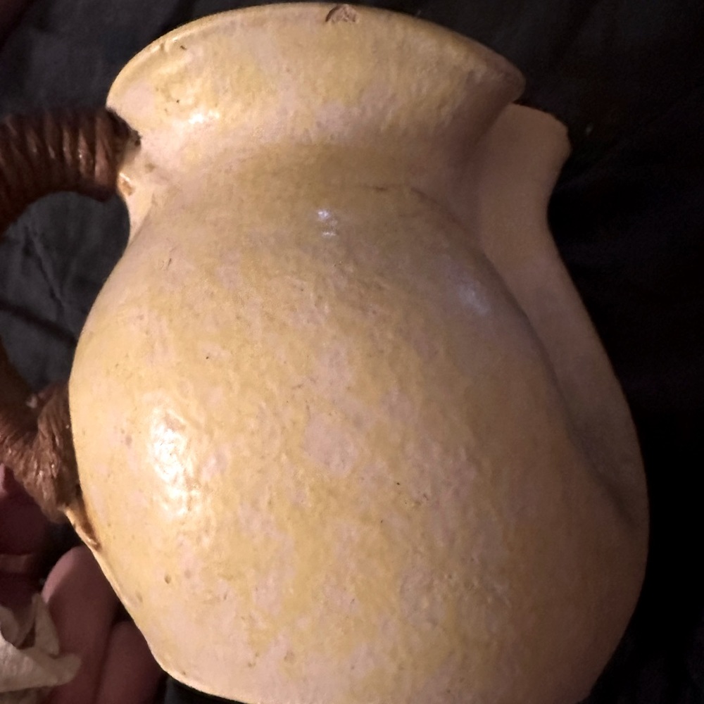 Yellow pitcher with rope handle pottery